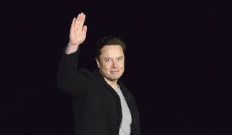 SpaceX&#39;s Elon Musk waves while providing an update on Starship, on Feb. 10, 2022, near Brownsville, Texas. (Miguel Roberts/The Brownsville Herald via AP, File)
