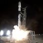In this image made from video provided by NASA, a SpaceX rocket carrying the Surface Water and Ocean Topography satellite lifts off from Vandenberg Space Force Base in California, Friday, Dec. 16, 2022. (NASA via AP)