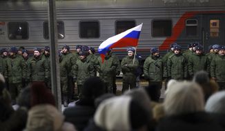 Soldiers who were recently mobilized by Russia for the military operation in Ukraine stand at a ceremony before boarding a train at a railway station in Tyumen, Russia, Friday, Dec. 2, 2022. Russian President Vladimir Putin&#39;s order to mobilize reservists for the conflict prompted large numbers of Russians to leave the country. (AP Photo, File)