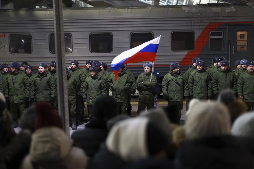 Soldiers who were recently mobilized by Russia for the military operation in Ukraine stand at a ceremony before boarding a train at a railway station in Tyumen, Russia, Friday, Dec. 2, 2022. Russian President Vladimir Putin&#x27;s order to mobilize reservists for the conflict prompted large numbers of Russians to leave the country. (AP Photo, File)