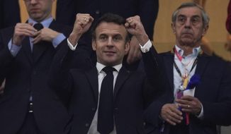 French president Emmanuel Macron gestures during the World Cup semifinal soccer match between France and Morocco at the Al Bayt Stadium in Al Khor, Qatar, on Dec. 14, 2022. Macron is about to jet off to Qatar for the second time in a week, despite broad concerns about the emirate&#39;s human rights and environmental record. Why? Because France is in the World Cup final, and Macron really is a big football fan — as well as a prominent advocate of the longstanding partnership between the two countries. (AP Photo/Manu Fernandez, File)