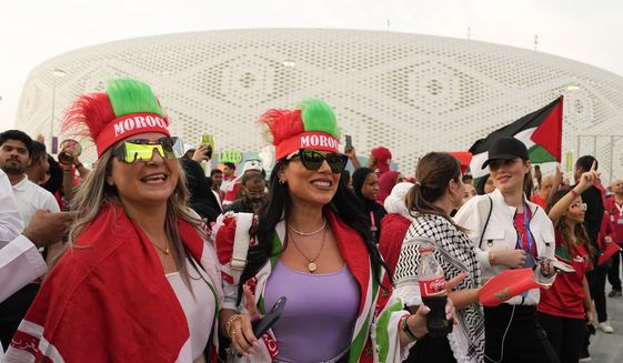 Female Morocco fans arrive at the stadium before the World Cup quarterfinal soccer match between Morocco and Portugal, at Al Thumama Stadium in Doha, Qatar, Saturday, Dec. 10, 2022. (AP Photo/Ebrahim Noroozi, File) **FILE**