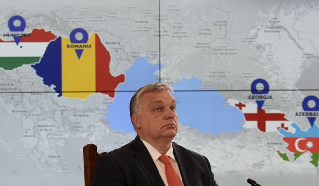Hungarian Prime Minister Viktor Orban is backdropped by a screen showing the countries that signed a strategic energy partnership at the Cotroceni presidential palace in Bucharest, Romania, Saturday, Dec. 17, 2022. The leaders of Hungary, Romania, Georgia and Azerbaijan met in Romania&#x27;s capital to conclude an agreement on an undersea electricity connector that could become a new power source for the European Union amid a crunch on energy supplies caused by the war in Ukraine. (AP Photo/Vadim Ghirda)