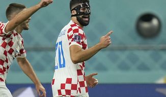 Croatia&#39;s Josko Gvardiol, right, celebrates after scoring his side&#39;s opening goal during the World Cup third-place playoff soccer match between Croatia and Morocco at Khalifa International Stadium in Doha, Qatar, Saturday, Dec. 17, 2022. (AP Photo/Francisco Seco)