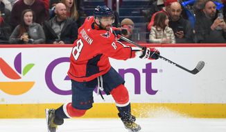 Washington Capitals left wing Alex Ovechkin (8) following through on a shot during the 3rd period in an NHL game against the Toronto Maple Leafs at Capital One Arena in Washington D.C., December 17, 2022. (Photo by Billy Sabatini)