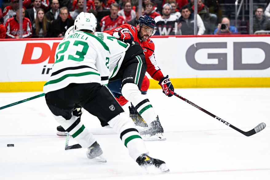 Washington Capitals left wing Alex Ovechkin (8) scans for the loose puck against the Dallas Stars at Capital One Arena, Washington, D.C., December 15, 2022. (Photo by Brian Murphy)