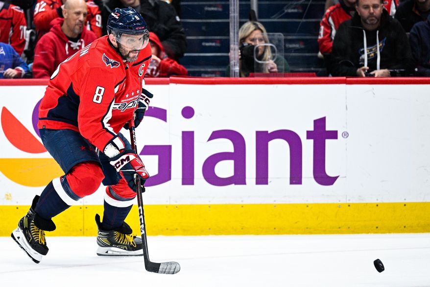 Washington Capitals left wing Alex Ovechkin (8) tracks the bouncing puck against the Dallas Stars at Capital One Arena, Washington, D.C., December 15, 2022. (Photo by Brian Murphy)