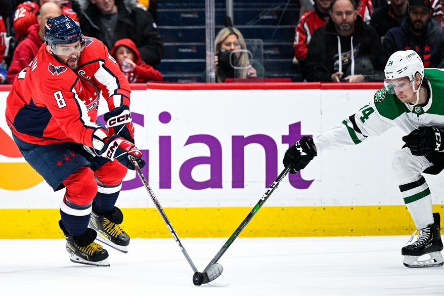 Washington Capitals left wing Alex Ovechkin (8) tracks the bouncing puck against the Dallas Stars at Capital One Arena, Washington, D.C., December 15, 2022. (Photo by Brian Murphy)