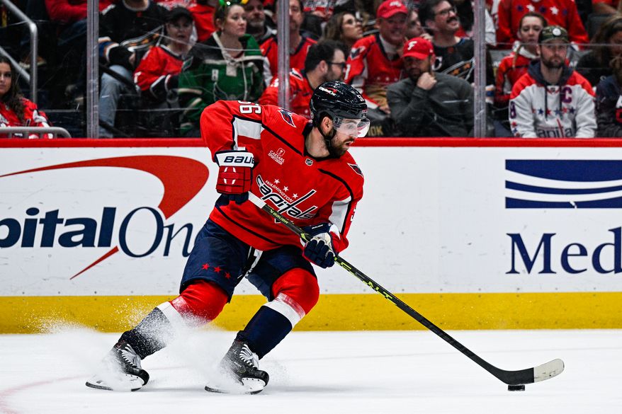Washington Capitals defenseman Erik Gustafsson (56) gains control of the puck on net against the Dallas Stars at Capital One Arena, Washington, D.C., December 15, 2022. (Photo by Brian Murphy)