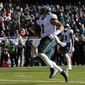 Philadelphia Eagles&#39; Jalen Hurts runs for a touchdown during the first half of an NFL football game against the Chicago Bears, Sunday, Dec. 18, 2022, in Chicago. (AP Photo/Nam Y. Huh)