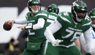 New York Jets quarterback Zach Wilson (2) steps back to pass against the Detroit Lions during the first quarter of an NFL football game, Sunday, Dec. 18, 2022, in East Rutherford, N.J. (AP Photo/Seth Wenig)