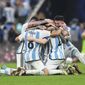 Argentina players celebrate winning the World Cup final soccer match between Argentina and France at the Lusail Stadium in Lusail, Qatar, Sunday, Dec.18, 2022. (AP Photo/Manu Fernandez)