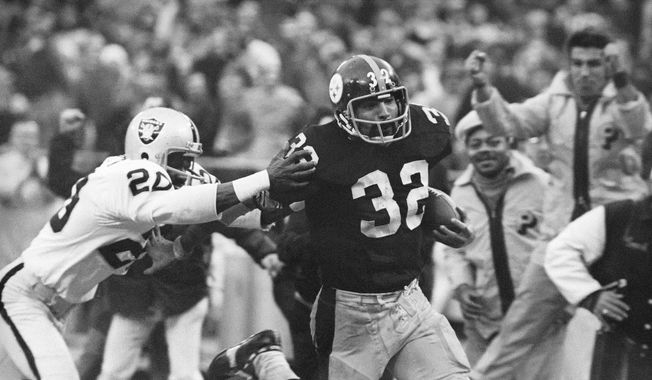 Pittsburgh Steelers&#x27; Franco Harris (32) eludes a tackle by Oakland Raiders&#x27; Jimmy Warren as he runs 42-yards for a touchdown after catching a deflected pass during an AFC Divisional NFL football playoff game in Pittsburgh, Dec. 23, 1972. Harris&#x27; scoop of a deflected pass and subsequent run for the winning touchdown — forever known as the &amp;quot;Immaculate Reception&amp;quot; — has been voted the greatest play in NFL history. On the 50th anniversary of the &amp;quot;Immaculate Reception&amp;quot; — Friday, Dec. 23, 2022 — Pittsburghers recall how it boosted morale during the collapse of the steel industry and has served as a cultural rallying point ever since. (AP Photo/Harry Cabluck, File)