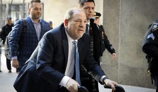 Harvey Weinstein arrives at a Manhattan courthouse as jury deliberations continue in his rape trial in New York, on Feb. 24, 2020. Jurors reached a verdict Monday, Dec. 19, 2022, at the Los Angeles rape and sexual assault trial of Weinstein. Weinstein and lawyers for both sides are headed to the courtroom, where the verdict will be read later Monday. (AP Photo/John Minchillo, File)