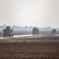 U.S. military vehicles on a patrol in the countryside near the town of Qamishli, Syria, Sunday, Dec. 4, 2022. U.S. and Kurdish-led forces had arrested an Islamic State group militant in eastern Syria. The Kurdish-led Syrian Democratic Forces said in a statement Monday, Dec. 19, 2022, that they raided the home of an unnamed IS militant leader in the western countryside of Deir el-Zour and arrested him. (AP Photo/Baderkhan Ahmad, File)