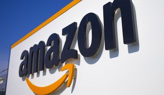A company logo is seen at the entrance of Amazon, in Douai, northern France, on April 16, 2020. Amazon has agreed to make major changes to its business practices to settle antitrust investigations that found the e-commerce giant gave itself an unfair advantage over rival merchants, European Union regulators said Tuesday, Dec. 20, 2022. (AP Photo/Michel Spingler, File)