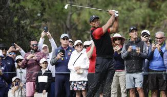 Tiger Woods tees off on the 4th hole during the final round of the PNC Championship golf tournament Sunday, Dec. 18, 2022, in Orlando, Fla. (AP Photo/Kevin Kolczynski) **FILE**