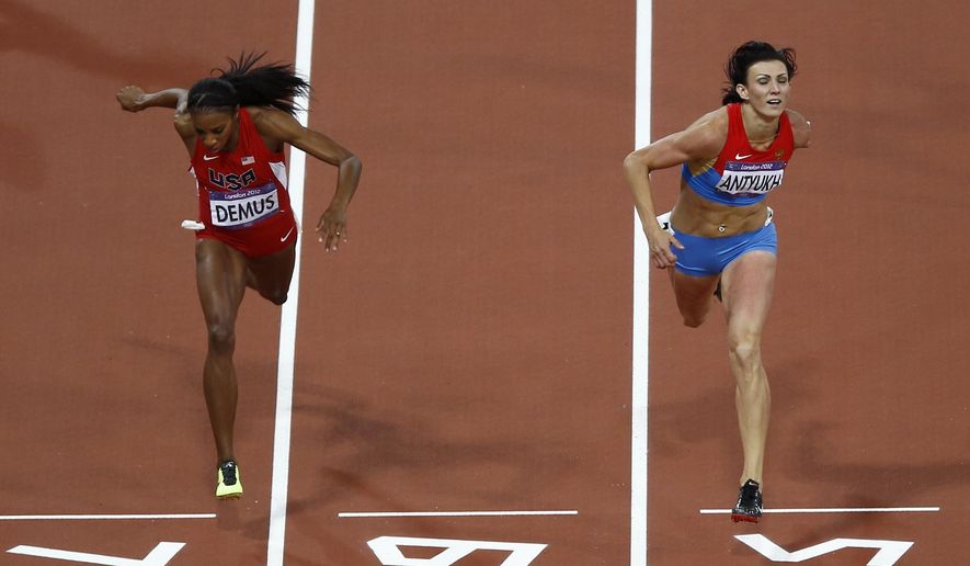 Russia&#39;s Natalya Antyukh, right, powers ahead of United States&#39; Lashinda Demus to win gold in the women&#39;s 400-meter hurdles final during the athletics in the Olympic Stadium at the 2012 Summer Olympics in London, Wednesday, Aug. 8, 2012. Russian 400-meter hurdler Natalya Antyukh will lose her gold medal from the 2012 London Games due to doping, putting American Lashinda Demus in position to be named the champion more than a decade after the race. (AP Photo/Daniel Ochoa De Olza, File)