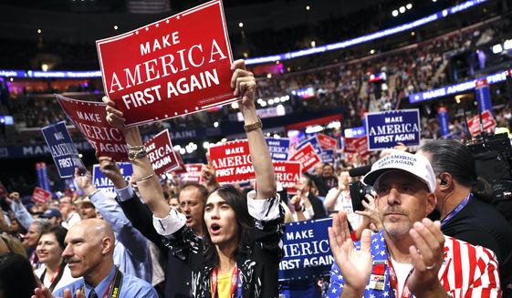 Delegates cheer during the third day session of the Republican National Convention in Cleveland, Wednesday, July 20, 2016. (AP Photo/Mary Altaffer)