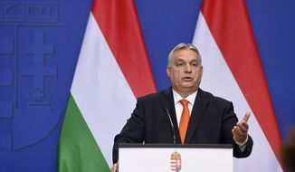 Hungarian Prime Minister Viktor Orban holds a year end international press conference at the government headquarters in Budapest, Hungary, Wednesday, Dec. 21, 2022. (Szilard Koszticsak/MTI via AP)
