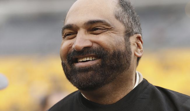 FILE - Former Pittsburgh Steelers pro football hall of fame running back Franco Harris takes part in festivities celebrating the 40th anniversary of the 1974 Steelers before an NFL football game between the Pittsburgh Steelers and the New Orleans Saints in Pittsburgh, Sunday, Nov. 30, 2014. Franco Harris, the Hall of Fame running back whose heads-up thinking authored “The Immaculate Reception,” considered the most iconic play in NFL history, died Wednesday, Dec. 21, 2022. He was 72. (AP Photo/Gene J. Puskar, File)
