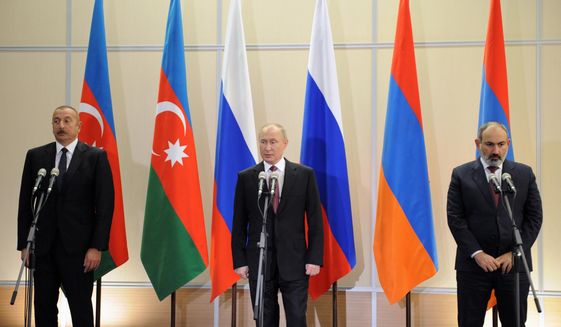 Russian President Vladimir Putin, center, Azerbaijan&#x27;s President Ilham Aliyev, left, and Armenia&#x27;s Prime Minister Nikol Pashinyan attention a news conference during their meeting in the Bocharov Ruchei residence in the Black Sea resort Sochi, Russia, on Nov. 26, 2021. A senior U.N. official urged the international community Tuesday, Dec. 20, 2022, to prevent Armenia and Azerbaijan from resuming their conflict over the disputed Nagorno-Karabakh region as the two countries accused each other of violating a Russian-brokered peace agreement.(Mikhail Klimentyev, Sputnik, Kremlin Pool Photo via AP, File)