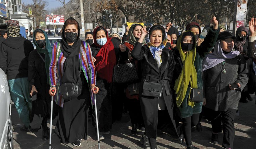Afghan women chant slogans during a protest against the ban on university education for women, in Kabul, Afghanistan, Thursday, Dec. 22, 2022. (AP Photo)