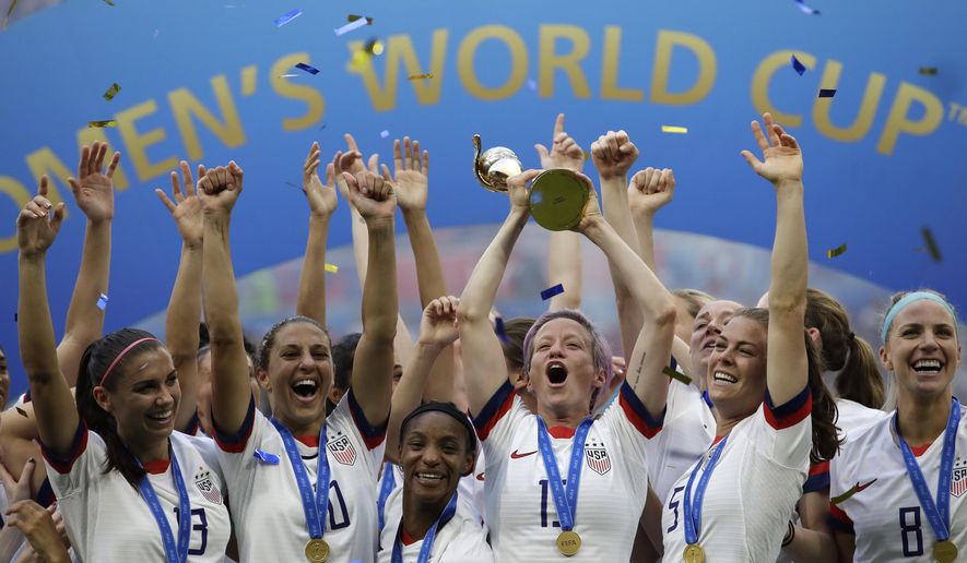 FILE - United States&#x27; Megan Rapinoe lifts up a trophy after winning the Women&#x27;s World Cup final soccer match between U.S. and The Netherlands at the Stade de Lyon in Decines, outside Lyon, France, July 7, 2019. The House has passed a bill that ensures equal compensation for U.S. women competing in international events, a piece of legislation that came out of the U.S. women&#x27;s soccer team&#x27;s long battle to be paid as much as the men. The Equal Pay for Team USA Act, passed late Wednesday night,  Dec. 21, 2022, now heads to President Joe Biden&#x27;s desk. (AP Photo/Alessandra Tarantino, File)