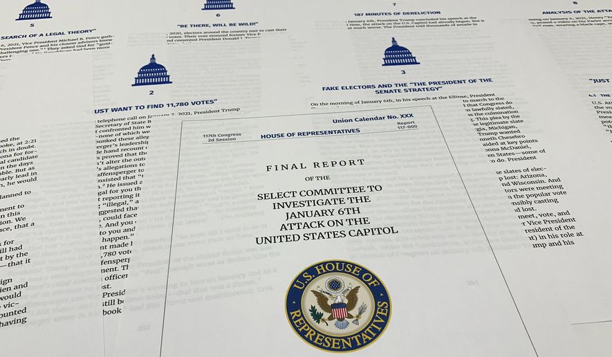 Pages from the final report released by the House select committee investigating the Jan. 6 attack on the U.S. Capitol, is photographed Thursday, Dec. 22, 2022. (AP Photo/Jon Elswick)