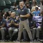 George Washington head coach Chris Caputo is seen on the sidelines as his team takes on Washington State during the first half of an NCAA college basketball game, Thursday, Dec. 22, 2022, in Honolulu. (AP Photo/Marco Garcia)  **FILE**