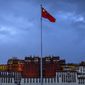 The Chinese flag flies at a plaza near the Potala Palace in Lhasa in western China&#39;s Tibet Autonomous Region, on June 1, 2021, as seen during a government-organized visit for foreign journalists. China has sanctioned two U.S. individuals in retaliation for action taken by Washington over human rights abuses in Tibet, the government said Friday, Dec. 23, 2022, amid a continuing standoff between the sides over Beijing&#39;s treatment of religious and ethnic minorities. (AP Photo/Mark Schiefelbein, File)