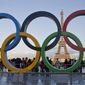 The Olympic rings are set up at Trocadero plaza that overlooks the Eiffel Tower, a day after the official announcement that the 2024 Summer Olympic Games will be in the French capital, in Paris, Thursday, Sept. 14, 2017. The budget for the 2024 Paris Olympics is expected to go up by 10%, in part because of high inflation, organizers said Tuesday, Nov.22, 2022. The organizing committee, known as COJO, had an original budget of around 4 billion euros ($4.1 billion) but will present a revised figure at a board meeting next month that is expected to reach 4.4 billion euros ($4.5 billion). (AP Photo//Michel Euler, File)
