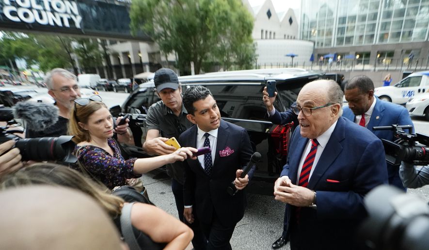 Rudy Giuliani arrives at the Fulton County Courthouse on Wednesday, Aug. 17, 2022, in Atlanta. A special grand jury investigating whether then-President Donald Trump and his allies illegally tried to overturn his defeat in the 2020 election in Georgia appears to be wrapping up its work, but many questions remain. (AP Photo/John Bazemore, File)