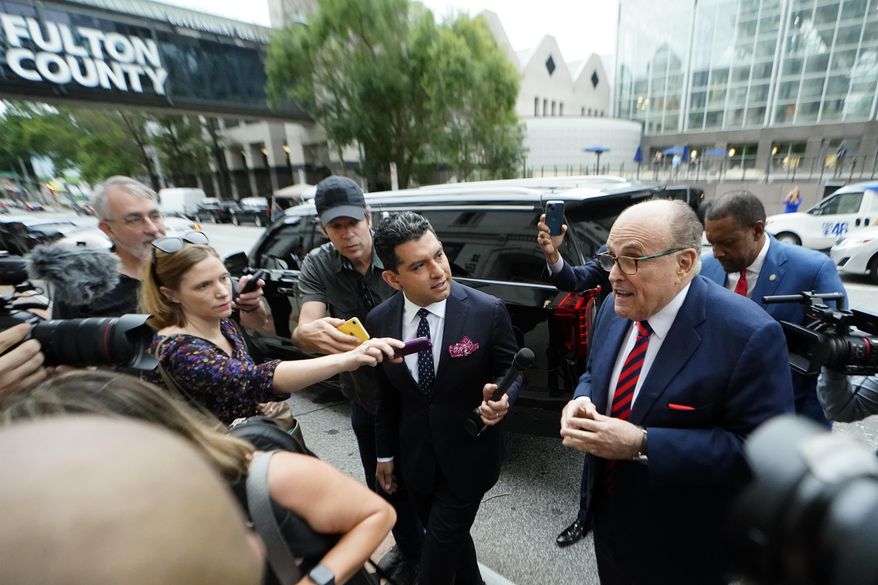 Rudy Giuliani arrives at the Fulton County Courthouse on Wednesday, Aug. 17, 2022, in Atlanta. A special grand jury investigating whether then-President Donald Trump and his allies illegally tried to overturn his defeat in the 2020 election in Georgia appears to be wrapping up its work, but many questions remain. (AP Photo/John Bazemore, File)