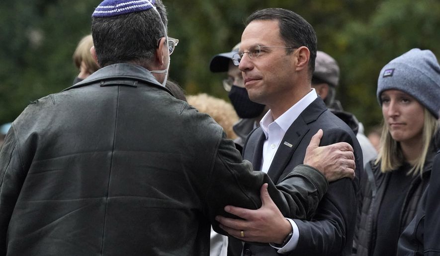 FILE - Pennsylvania Attorney General Josh Shapiro, center, attends a Commemoration Ceremony in Schenley Park, in Pittsburgh&#x27;s Squirrel Hill neighborhood, on Wednesday, Oct. 27, 2021, three years after a gunman killed 11 worshippers at the Tree of Life Synagogue. Shapiro will be taking office as Pennsylvania&#x27;s next governor in January 2023 after running a campaign in which he spoke early and often about his Jewish religious heritage. (AP Photo/Gene J. Puskar, File)