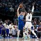 Dallas Mavericks guard Luka Doncic (77) attempts to pass the ball in the first half of an NBA basketball game in Dallas, Sunday, Dec. 25, 2022. (AP Photo/Emil T. Lippe)