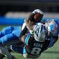 Detroit Lions running back Jamaal Williams is tackled by Carolina Panthers cornerback Jaycee Horn during the second half of an NFL football game between the Carolina Panthers and the Detroit Lions on Saturday, Dec. 24, 2022, in Charlotte, N.C. (AP Photo/Rusty Jones)  **FILE**