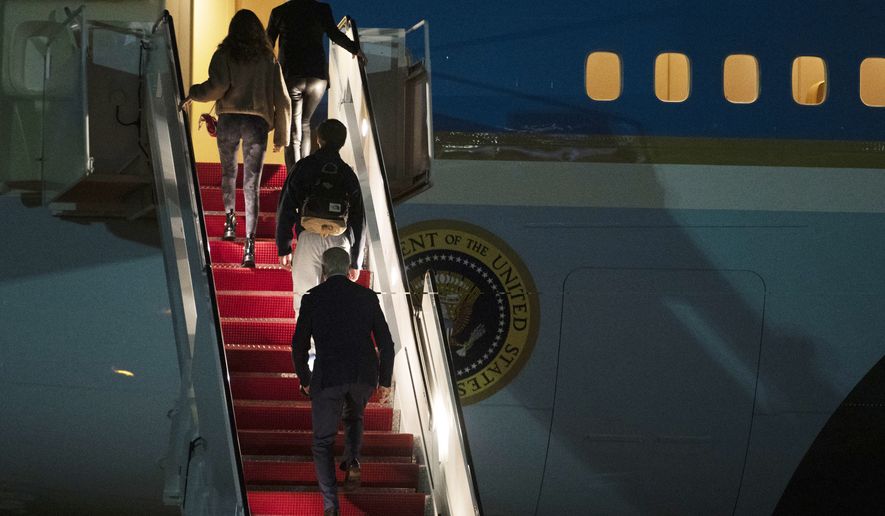President Joe Biden, bottom, first lady Jill Biden, top, and their grandchildren Natalie and Robert, board Air Force One at Andrews Air Force Base, Md., Tuesday, Dec. 27, 2022. Biden and his family are traveling to St..Croix, U.S. Virgin Islands to celebrate the New Year. (AP Photo/Cliff Owen)