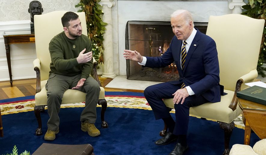 President Joe Biden speaks with Ukrainian President Volodymyr Zelenskyy as they meet in the Oval Office of the White House, Dec. 21, 2022, in Washington. (AP Photo/Patrick Semansky, File)
