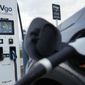 An electric vehicle charges at an EVgo fast charging station in Detroit, Wednesday, Nov. 16, 2022. (AP Photo/Paul Sancya)