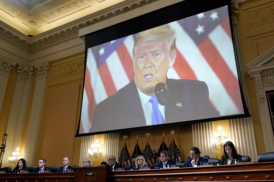 A video of former President Donald Trump is shown on a screen, as the House select committee investigating the Jan. 6 attack on the U.S. Capitol holds its final meeting on Capitol Hill in Washington, Dec. 19, 2022. From left to right, Rep. Stephanie Murphy, D-Fla., Rep. Pete Aguilar, D-Calif., Rep. Adam Schiff, D-Calif., Rep. Zoe Lofgren, D-Calif., Chairman Bennie Thompson, D-Miss., Vice Chair Liz Cheney, R-Wyo., Rep. Adam Kinzinger, R-Ill., Rep. Jamie Raskin, D-Md., and Rep. Elaine Luria, D-Va. (AP Photo/J. Scott Applewhite, File)