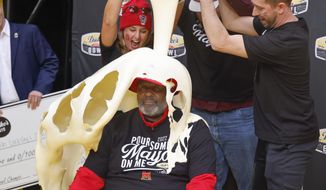 Maryland head coach Mike Locksley is doused with Duke&#39;s Mayo after Maryland defeated North Carolina State 16-12 in the Duke&#39;s Mayo Bowl NCAA college football game in Charlotte, N.C., Friday, Dec. 30, 2022. (AP Photo/Nell Redmond)