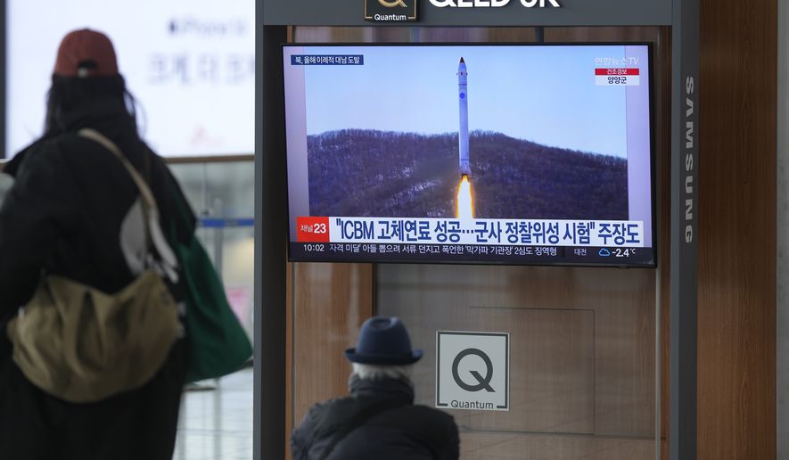 A TV screen shows a file image of North Korea&#x27;s rocket with the test satellite during a news program at the Seoul Railway Station in Seoul, South Korea, Saturday, Dec. 31, 2022. North Korea fired three short-range ballistic missiles toward its eastern waters on Saturday, the latest in a barrage of weapons tests this year that came days after it increased tensions by allegedly flying drones into South Korean airspace. (AP Photo/Lee Jin-man)