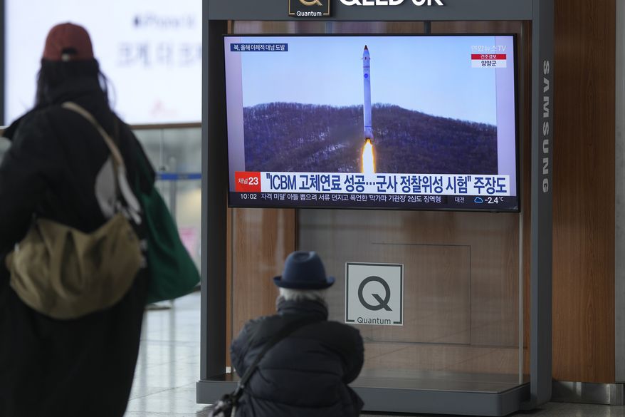 A TV screen shows a file image of North Korea&#x27;s rocket with the test satellite during a news program at the Seoul Railway Station in Seoul, South Korea, Saturday, Dec. 31, 2022. North Korea fired three short-range ballistic missiles toward its eastern waters on Saturday, the latest in a barrage of weapons tests this year that came days after it increased tensions by allegedly flying drones into South Korean airspace. (AP Photo/Lee Jin-man)
