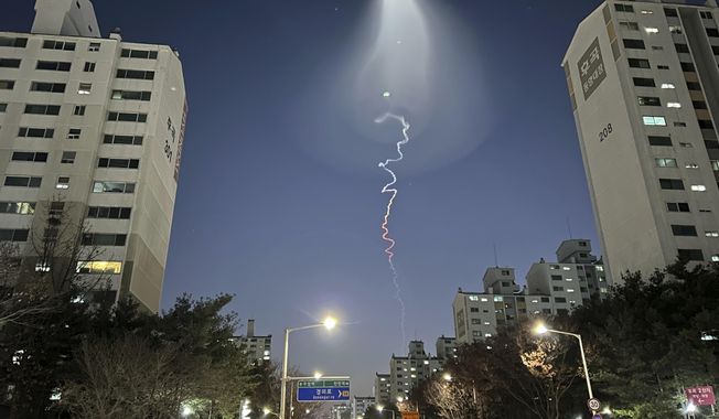 The light trail is seen in Goyang, South Korea, Friday, Dec. 30, 2022. South Korea&#x27;s military confirmed it test-fired a solid-fueled rocket on Friday, after its unannounced launch triggered brief public scare of a suspected UFO appearance or a North Korean missile or drone flying. (AP Photo/Ahn Young-joon)