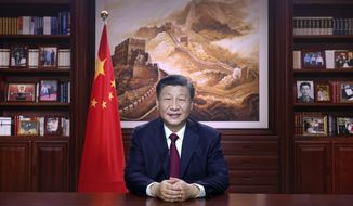 In this photo released by Xinhua News Agency, Chinese President Xi Jinping delivers a New Year address in Beijing, Saturday, Dec. 31, 2022. (Ju Peng/Xinhua via AP) ** FILE **