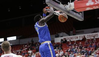 UCLA forward Adem Bona dunks during the first half of the team&#39;s NCAA college basketball game against Washington State, Friday, Dec. 30, 2022, in Pullman, Wash. (AP Photo/Young Kwak)