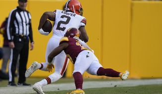Cleveland Browns wide receiver Amari Cooper (2) gets past Washington Commanders cornerback Kendall Fuller (29) to score a touchdown during the second half of an NFL football game, Sunday, Jan. 1, 2023, in Landover, Md. (AP Photo/Susan Walsh)
