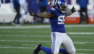 New York Giants linebacker Jihad Ward (55) celebrates after the Indianapolis Colts missed a field goal during the second half of an NFL football game, Sunday, Jan. 1, 2023, in East Rutherford, N.J. (AP Photo/Seth Wenig)