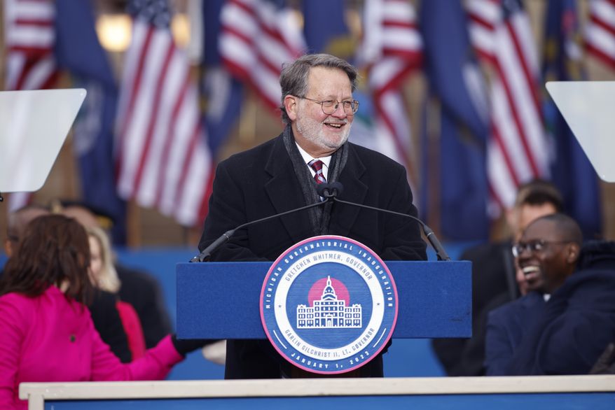 Sen. Gary Peters addresses the crowd during inauguration ceremonies, Sunday, Jan. 1, 2023, outside the state Capitol in Lansing, Mich. (AP Photo/Al Goldis)